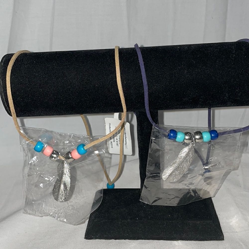 Two feather necklaces 